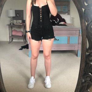 Free People ripped black denim shorts